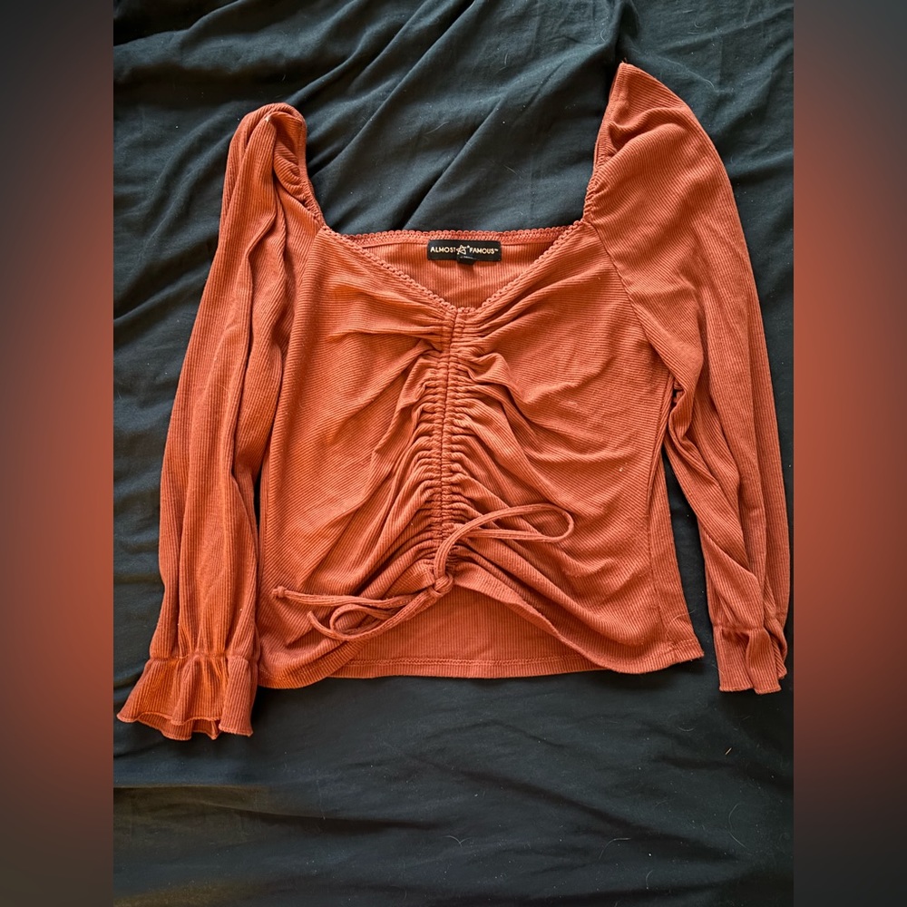 Woman’s orange crop top blouse